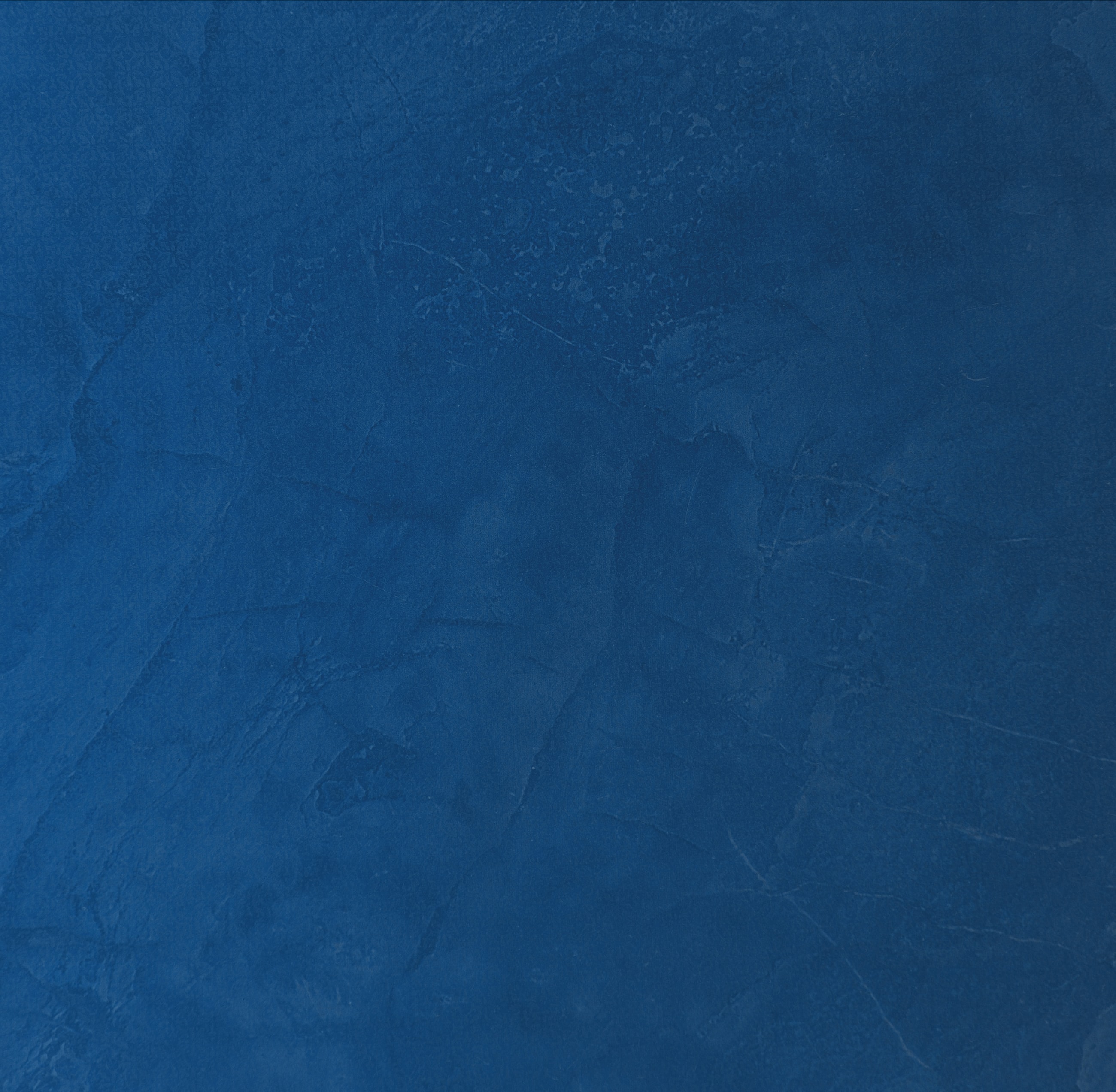 Textured deep blue background surface.