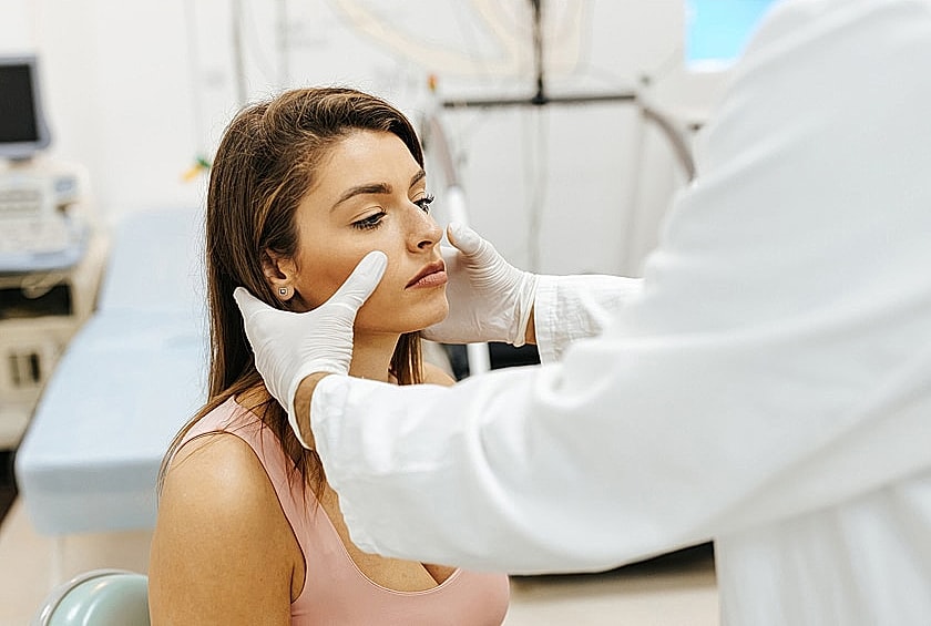 Consultation for cosmetic facial treatment in clinic.